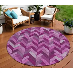 Photo of 8' Pink And Ivory Round Geometric Washable Indoor Outdoor Area Rug