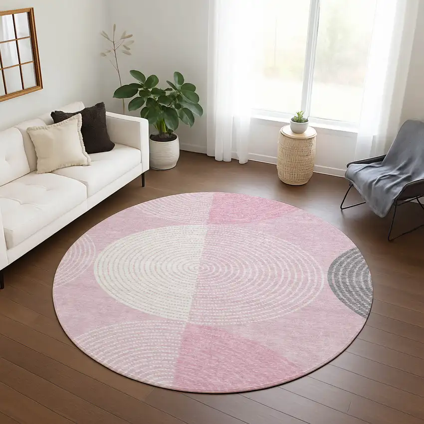 8' Pink And Ivory Round Geometric Washable Indoor Outdoor Area Rug Photo 9