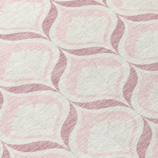8' Pink And Ivory Round Geometric Washable Indoor Outdoor Area Rug Photo 9