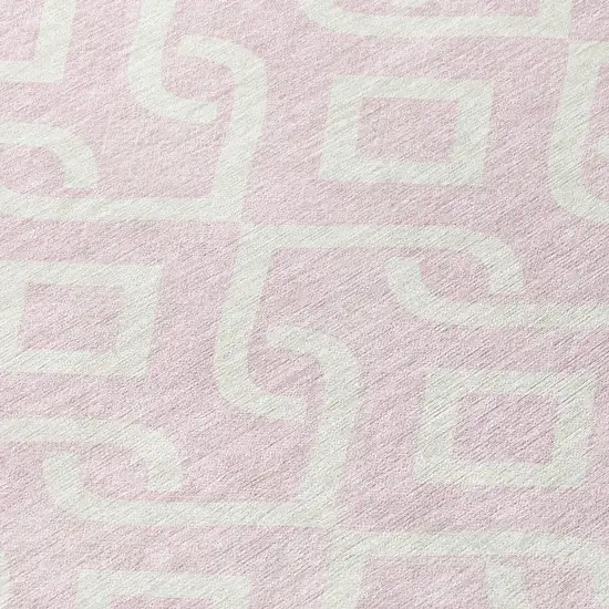 8' Pink And Ivory Round Geometric Washable Indoor Outdoor Area Rug Photo 7