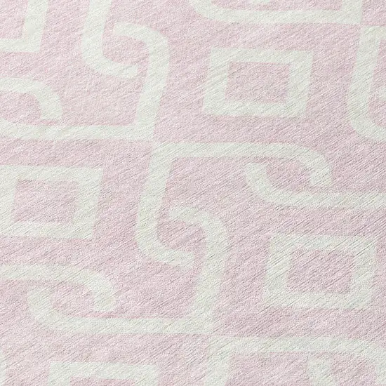 8' Pink And Ivory Round Geometric Washable Indoor Outdoor Area Rug Photo 7