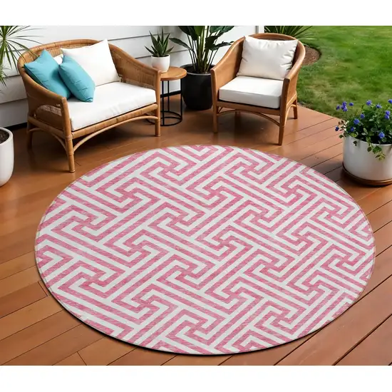 8' Pink And Ivory Round Geometric Washable Indoor Outdoor Area Rug Photo 1