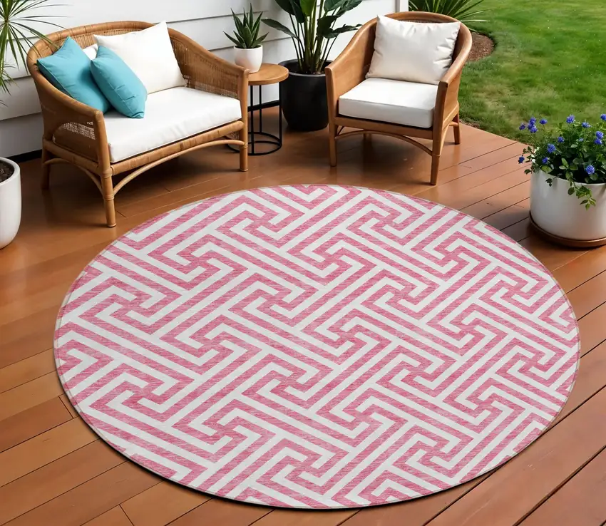 8' Pink And Ivory Round Geometric Washable Indoor Outdoor Area Rug Photo 1