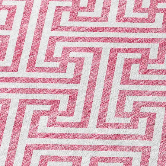 8' Pink And Ivory Round Geometric Washable Indoor Outdoor Area Rug Photo 5