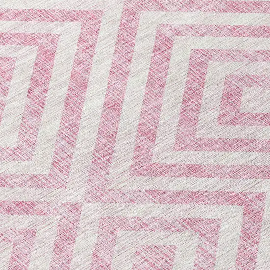 8' Pink And Ivory Round Geometric Washable Indoor Outdoor Area Rug Photo 4