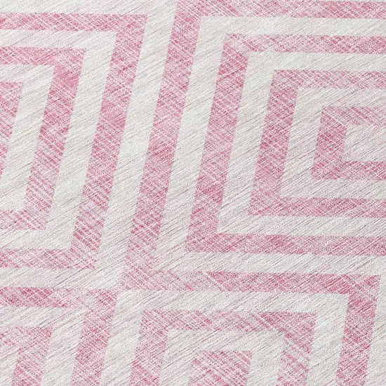 8' Pink And Ivory Round Geometric Washable Indoor Outdoor Area Rug Photo 4