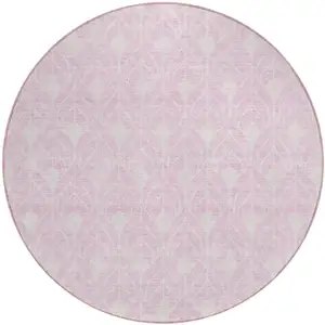 Photo of 8' Pink And Ivory Round Geometric Washable Indoor Outdoor Area Rug