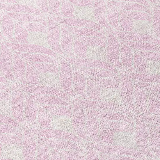 8' Pink And Ivory Round Geometric Washable Indoor Outdoor Area Rug Photo 8