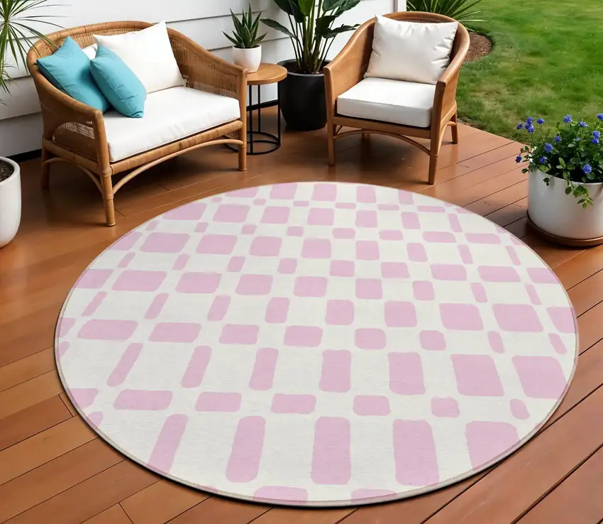 8' Pink And Ivory Round Geometric Washable Indoor Outdoor Area Rug Photo 1