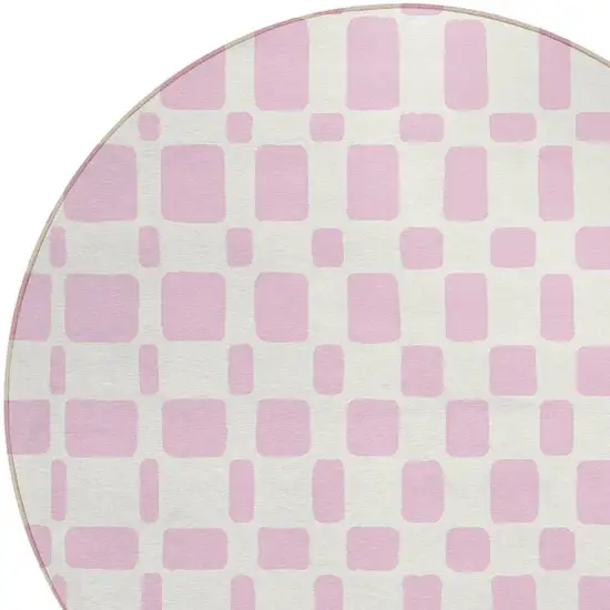 8' Pink And Ivory Round Geometric Washable Indoor Outdoor Area Rug Photo 4