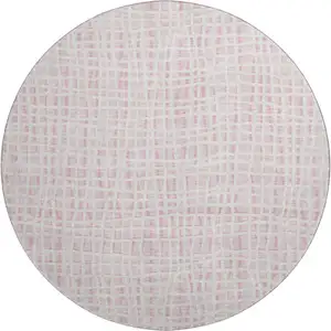 Photo of 8' Pink And Ivory Striped Washable Round Rug With UV Protection