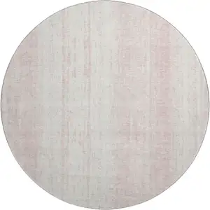 Photo of 8' Pink And Ivory Striped Washable Round Rug With UV Protection