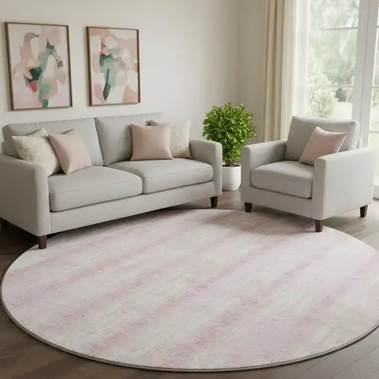 8' Pink And Ivory Striped Washable Round Rug With UV Protection Photo 1