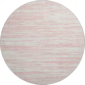 Photo of 8' Pink And Ivory Striped Washable Round Rug With UV Protection