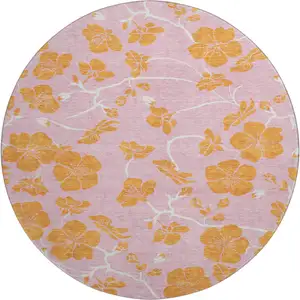 Photo of 8' Pink And Orange Floral Washable Round Rug With UV Protection