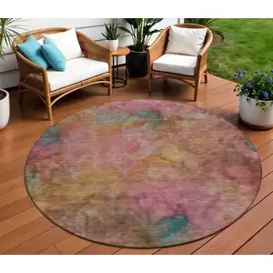 Photo of 8' Pink And Orange Round Abstract Washable Indoor Outdoor Area Rug