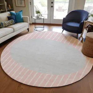 Photo of 8' Pink And Silver Round Striped Washable Indoor Outdoor Area Rug
