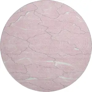 Photo of 8' Pink Gray And Ivory Abstract Washable Round Rug With UV Protection