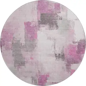 Photo of 8' Pink Gray And Ivory Abstract Washable Round Rug With UV Protection