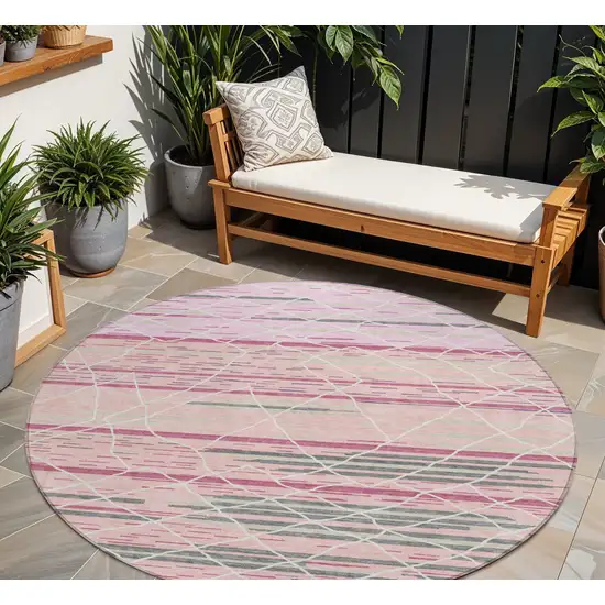 8' Pink Gray And Ivory Round Striped Washable Indoor Outdoor Area Rug Photo 1
