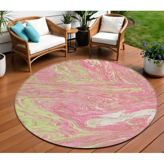 8' Pink Green And Ivory Round Abstract Washable Indoor Outdoor Area Rug Photo 1