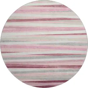 Photo of 8' Pink Ivory And Blush Striped Washable Round Rug With UV Protection
