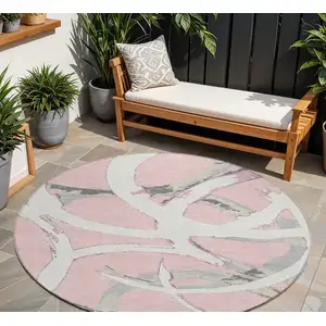 Photo of 8' Pink Ivory And Gray Round Abstract Washable Indoor Outdoor Area Rug