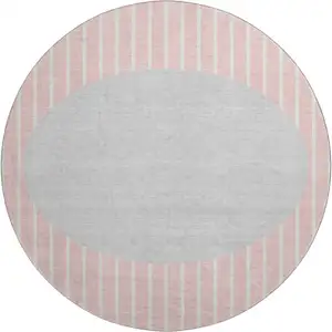 Photo of 8' Pink Ivory And Gray Striped Washable Round Rug With UV Protection