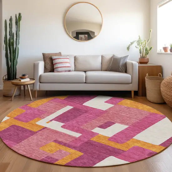 8' Pink Ivory And Orange Geometric Washable Round Rug With UV Protection Photo 3