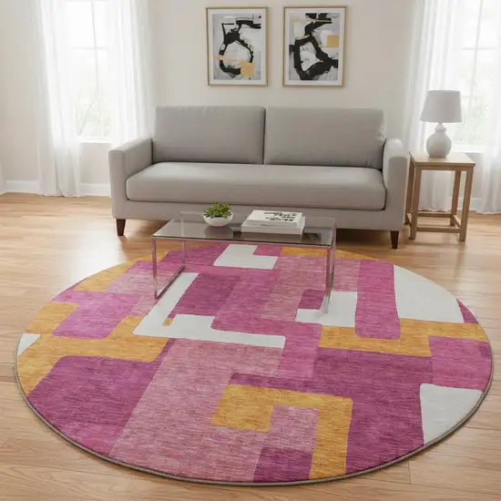 8' Pink Ivory And Orange Geometric Washable Round Rug With UV Protection Photo 2