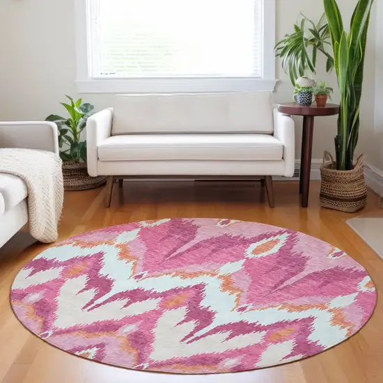 8' Pink Ivory And Orange Ikat Washable Round Rug With UV Protection Photo 5