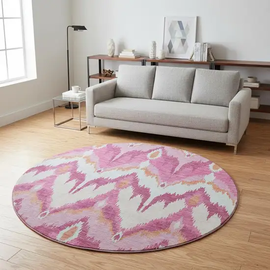8' Pink Ivory And Orange Ikat Washable Round Rug With UV Protection Photo 2