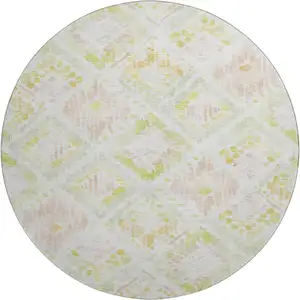 Photo of 8' Pink Lime Green And Ivory Geometric Washable Round Rug With UV Protection