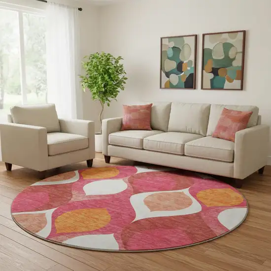 8' Pink Orange And Ivory Ogee Washable Round Rug With UV Protection Photo 1