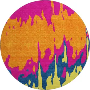 Photo of 8' Pink Orange Blue And Lime Green Abstract Washable Round Rug With UV Protection
