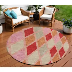 Photo of 8' Pink Red And Copper Round Geometric Washable Indoor Outdoor Area Rug