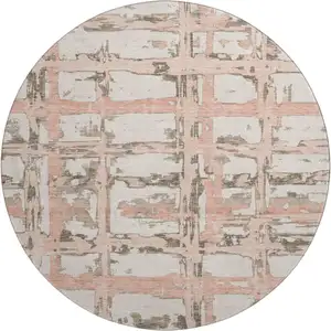 Photo of 8' Pink Taupe And Beige Striped Washable Round Rug With UV Protection