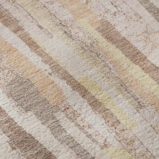 8' Pink Yellow And Peach Striped Washable Area Rug With UV Protection Photo 1