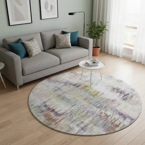 8' Plum Gold And Ivory Abstract Washable Round Rug With UV Protection Photo 2