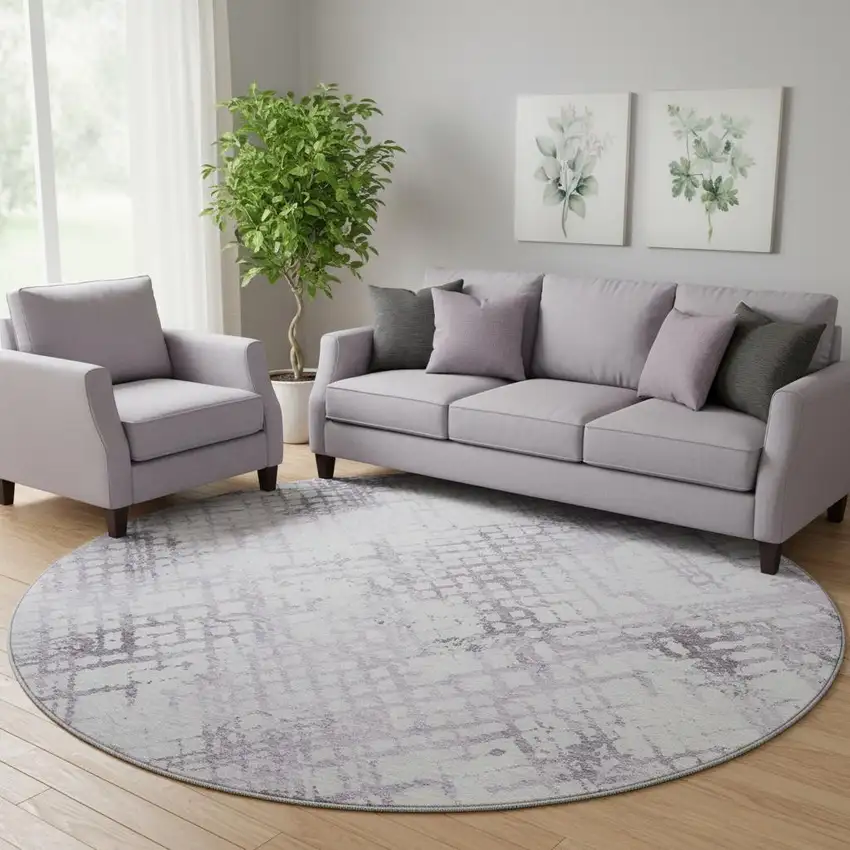 8' Purple And Ivory Abstract Geometric Washable Round Rug With UV Protection Photo 1