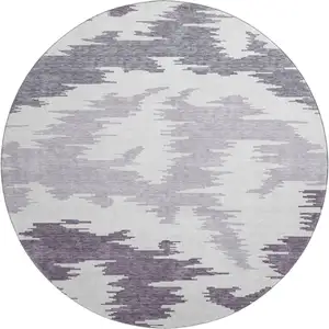 Photo of 8' Purple And Ivory Abstract Washable Round Rug With UV Protection
