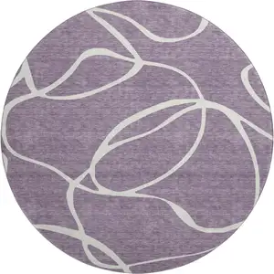 Photo of 8' Purple And Ivory Abstract Washable Round Rug With UV Protection