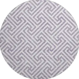 Photo of 8' Purple And Ivory Geometric Washable Round Rug With UV Protection