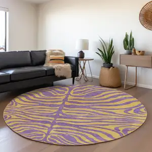 Photo of 8' Purple And Peach Animal Print Washable Round Rug With UV Protection