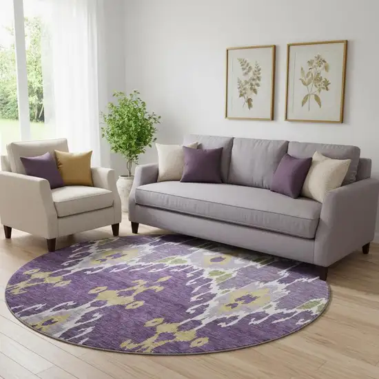 8' Purple Gold And Ivory Ikat Washable Round Rug With UV Protection Photo 1