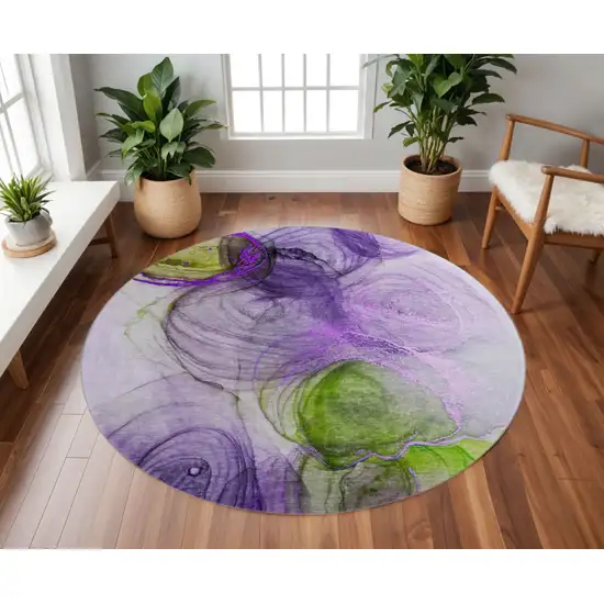 8' Purple Green And Ivory Abstract Washable Round Rug With UV Protection Photo 2
