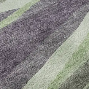 Photo of 8' Purple Green And Ivory Abstract Washable Round Rug With UV Protection