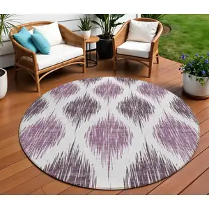Photo of 8' Purple Plum And Ivory Round Ikat Washable Indoor Outdoor Area Rug