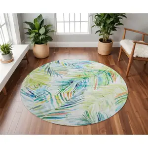 Photo of 8' Rainbow And Ivory Geometric Washable Round Rug With UV Protection