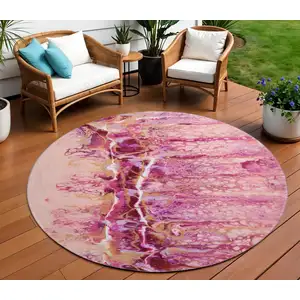 Photo of 8' Raspberry Ivory And Gold Round Abstract Washable Indoor Outdoor Area Rug